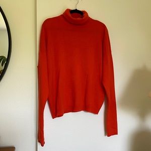 Orange cashmere turtleneck sweater